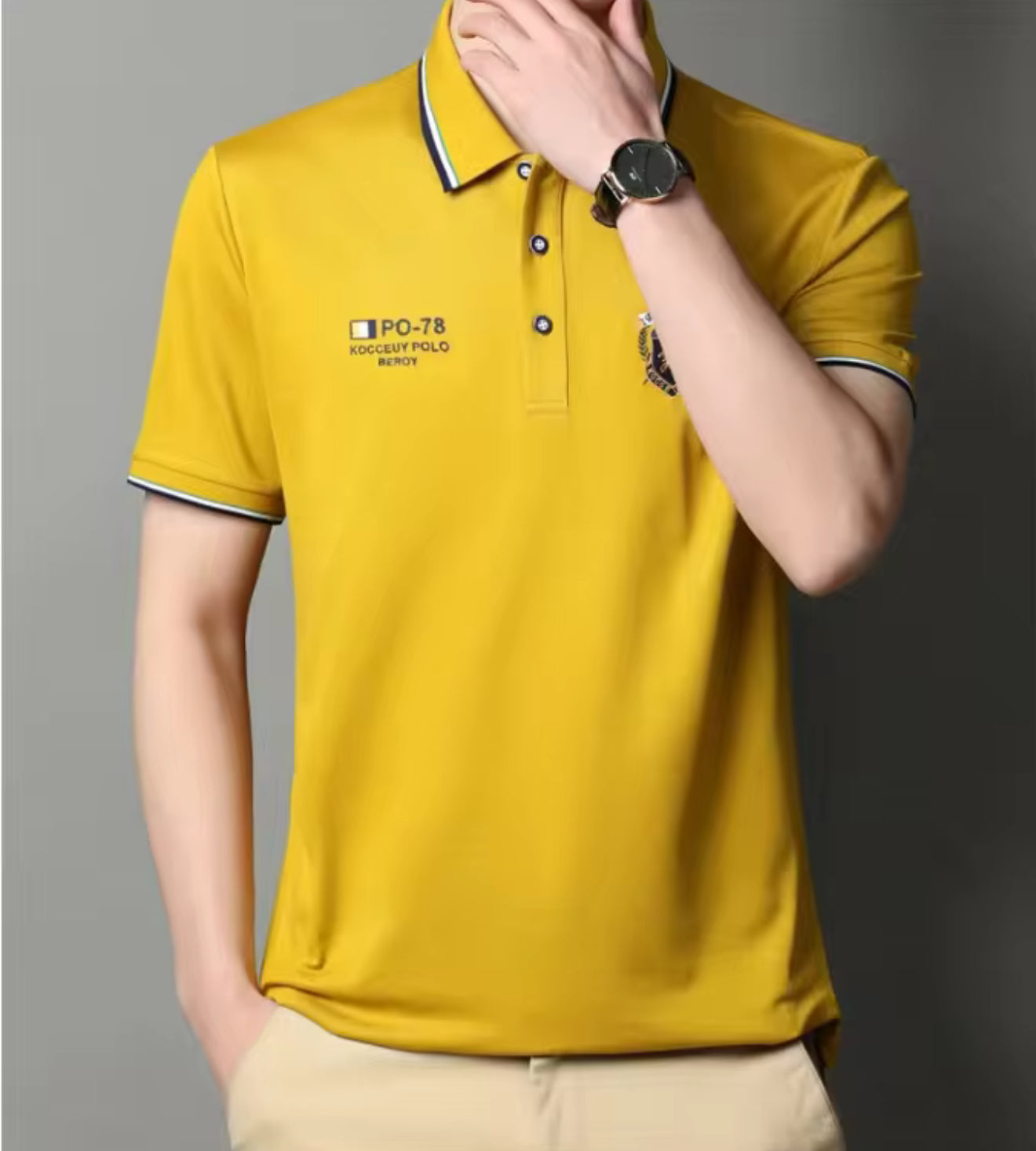 Model in yellow embroidered short-sleeved polo shirt, breathable, casual and professional style by AURORE LUXURE. A bright option for summer.