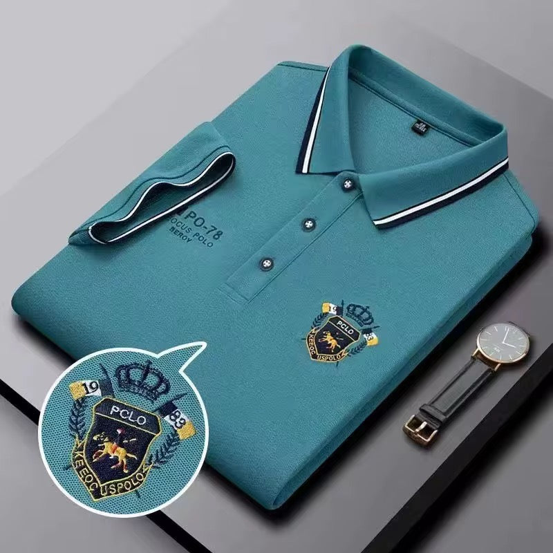 Teal embroidered short-sleeved polo shirt, breathable, casual and professional style by AURORE LUXURE. Perfect for summer wear.
