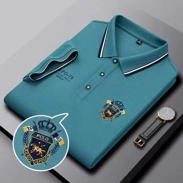 Teal embroidered short-sleeved polo shirt, breathable, casual and professional style by AURORE LUXURE. Perfect for summer wear.